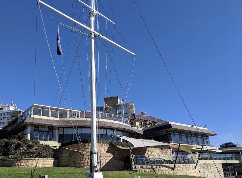 The clubhouse and flagstaff above the Harbour