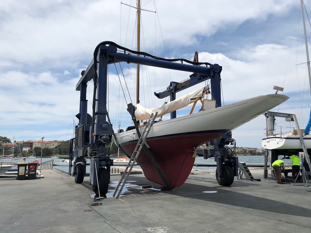 The travel lift in the yard, hauling out Defiance
